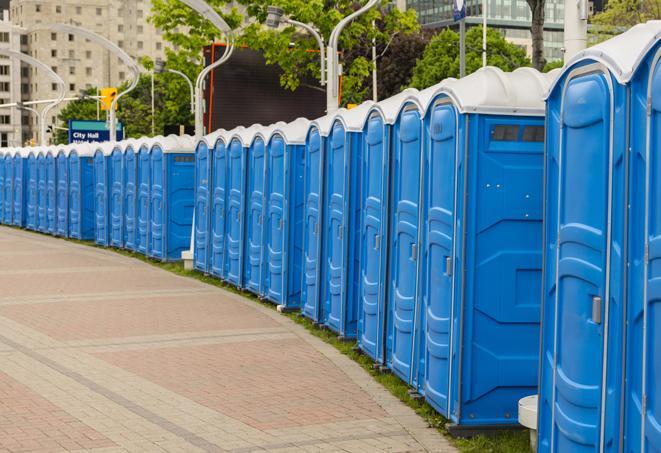 hygienic portable restrooms lined up at a music festival, providing comfort and convenience for attendees in Fairburn, GA